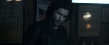 Movie still from “Deliver Us from Evil” (2014), directed by Scott Derrickson – A person wearing a black jacket; Close Up shot, Over the shoulder angle