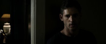 Movie still from “Deliver Us from Evil” (2014), directed by Scott Derrickson – A person in a dark room; Close Up shot, Over the shoulder angle