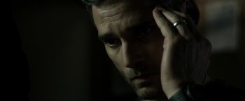 Movie still from “Deliver Us from Evil” (2014), directed by Scott Derrickson – A person with his hand on his head; Close Up shot, Over the shoulder angle