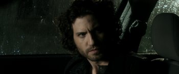 Movie still from “Deliver Us from Evil” (2014), directed by Scott Derrickson – A person with curly hair; Close Up shot, Over the shoulder angle