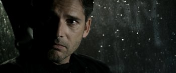 Movie still from “Deliver Us from Evil” (2014), directed by Scott Derrickson – A person wearing a black shirt; Close Up shot, Over the shoulder angle