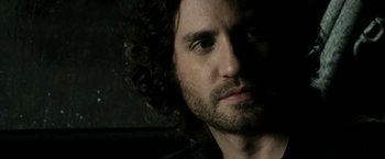 Movie still from “Deliver Us from Evil” (2014), directed by Scott Derrickson – A person with curly hair; Close Up shot, Over the shoulder angle