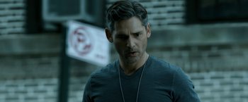 Movie still from “Deliver Us from Evil” (2014), directed by Scott Derrickson – A person wearing a black shirt; Close Up shot, Over the shoulder angle