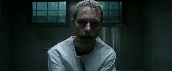 Movie still from “Deliver Us from Evil” (2014), directed by Scott Derrickson – A person wearing a white shirt with blood all over his face; Close Up shot, Low angle