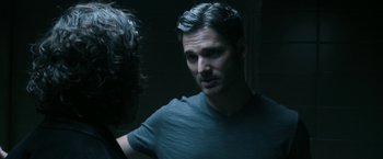 Movie still from “Deliver Us from Evil” (2014), directed by Scott Derrickson – A person in a dark room; Close Up shot, Over the shoulder angle