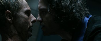 Movie still from “Deliver Us from Evil” (2014), directed by Scott Derrickson – Two men face to face in a dark room; Close Up shot, Over the shoulder angle