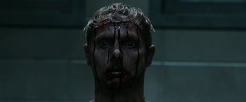 Movie still from “Deliver Us from Evil” (2014), directed by Scott Derrickson – A person with blood on his face; Close Up shot, Low angle
