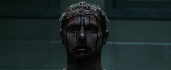 Movie still from “Deliver Us from Evil” (2014), directed by Scott Derrickson – A person with blood on his face; Close Up shot, Low angle