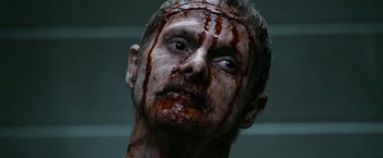 Movie still from “Deliver Us from Evil” (2014), directed by Scott Derrickson – A person with blood on his face; Close Up shot, Low angle