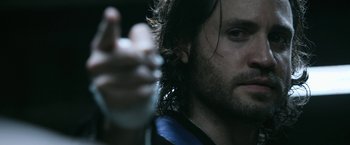 Movie still from “Deliver Us from Evil” (2014), directed by Scott Derrickson – A man with long dark hair; Close Up shot, Low angle