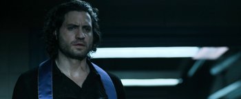Movie still from “Deliver Us from Evil” (2014), directed by Scott Derrickson – A person wearing a black shirt; Close Up shot, Over the shoulder angle
