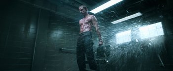 Movie still from “Deliver Us from Evil” (2014), directed by Scott Derrickson – A man standing in the rain in front of a shower; Medium shot, Low angle