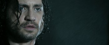 Movie still from “Deliver Us from Evil” (2014), directed by Scott Derrickson – A person with wet hair; Close Up shot, Low angle