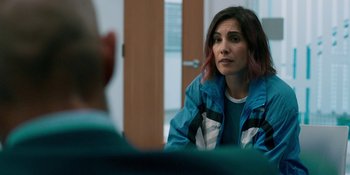 Movie still from “Demonic” (2021), directed by Neill Blomkamp – A woman sitting in front of a man in front of a wooden door; Close Up shot, Over the shoulder angle