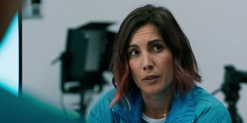 Movie still from “Demonic” (2021), directed by Neill Blomkamp – A person sitting in a room; Close Up shot, Over the shoulder angle