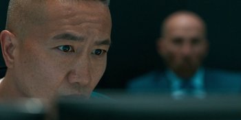 Movie still from “Demonic” (2021), directed by Neill Blomkamp – A man's eyes and face; Close Up shot, Over the shoulder angle