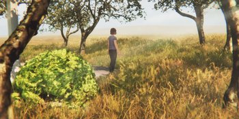 Movie still from “Demonic” (2021), directed by Neill Blomkamp – A woman standing in a field next to a tree; Extreme Wide shot, Over the shoulder angle