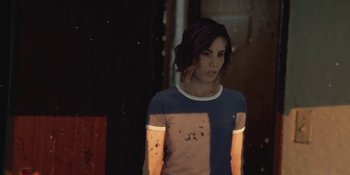 Movie still from “Demonic” (2021), directed by Neill Blomkamp – A woman standing in front of a window; Medium shot, High angle