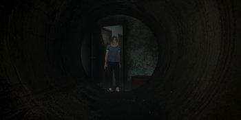 Movie still from “Demonic” (2021), directed by Neill Blomkamp – A woman standing in a doorway looking into a mirror; Wide shot, High angle