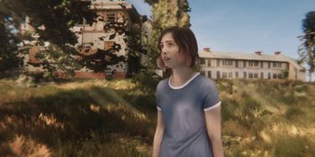 Movie still from “Demonic” (2021), directed by Neill Blomkamp – A woman standing in front of an abandoned house; Medium shot, Over the shoulder angle