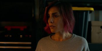 Movie still from “Demonic” (2021), directed by Neill Blomkamp – A person with pink hair; Close Up shot, Over the shoulder angle