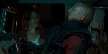 Movie still from “Demonic” (2021), directed by Neill Blomkamp – A woman standing next to a man in a car; Close Up shot, Over the shoulder angle