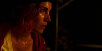 Movie still from “Demonic” (2021), directed by Neill Blomkamp – A person wearing a red shirt; Close Up shot, Over the shoulder angle