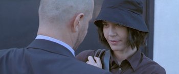 Movie still from “Demonlover” (2002), directed by Olivier Assayas – A man and a woman are looking at each other; Close Up shot, Over the shoulder angle