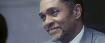 Movie still from “Demonlover” (2002), directed by Olivier Assayas – A man's face with a beard; Close Up shot, High angle