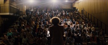 Movie still from “Denial” (2016), directed by Mick Jackson – A crowd of people sitting in front of an audience; Extreme Wide shot, High angle