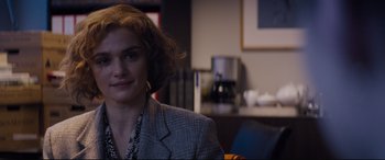 Movie still from “Denial” (2016), directed by Mick Jackson – A woman sitting in front of a coffee maker; Close Up shot, Over the shoulder angle