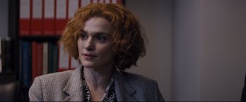 Movie still from “Denial” (2016), directed by Mick Jackson – A person with red hair; Close Up shot, Over the shoulder angle