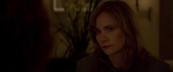 Movie still from “Denial” (2016), directed by Mick Jackson – A person wearing a necklace; Close Up shot, Over the shoulder angle