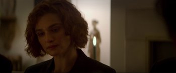 Movie still from “Denial” (2016), directed by Mick Jackson – A person in a room; Close Up shot, Over the shoulder angle