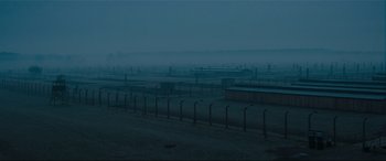 Movie still from “Denial” (2016), directed by Mick Jackson – A field that has a lot of barbed wire in it; Extreme Wide shot, High angle