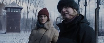 Movie still from “Denial” (2016), directed by Mick Jackson – Two women standing next to each other in the snow; Medium shot, Over the shoulder angle