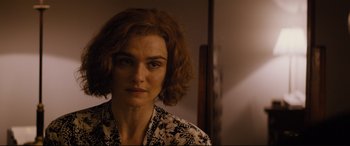 Movie still from “Denial” (2016), directed by Mick Jackson – A person wearing a black and white shirt; Close Up shot, Over the shoulder angle