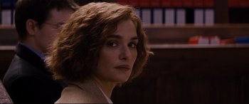 Movie still from “Denial” (2016), directed by Mick Jackson – A person wearing a jacket; Close Up shot, Over the shoulder angle