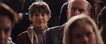 Movie still from “Denial” (2016), directed by Mick Jackson – An older woman is looking into the distance; Close Up shot, Over the shoulder angle