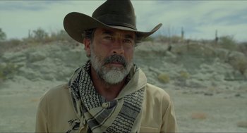 Movie still from “Desierto” (2015), directed by Jonás Cuarón – A man in a cowboy hat and a scarf; Close Up shot, Over the shoulder angle