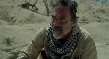 Movie still from “Desierto” (2015), directed by Jonás Cuarón – A man with a beard wearing a scarf and a jacket; Close Up shot, Over the shoulder angle