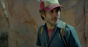 Movie still from “Desierto” (2015), directed by Jonás Cuarón – A person wearing a hat; Close Up shot, Low angle