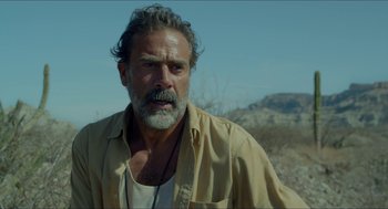 Movie still from “Desierto” (2015), directed by Jonás Cuarón – A person with a beard and mustache; Close Up shot, Over the shoulder angle