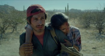 Movie still from “Desierto” (2015), directed by Jonás Cuarón – A man and a woman are walking in the desert; Close Up shot, Over the shoulder angle