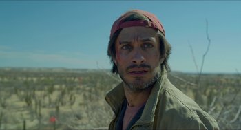 Movie still from “Desierto” (2015), directed by Jonás Cuarón – A person wearing a hat; Close Up shot, Low angle