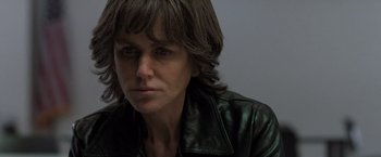 Movie still from “Destroyer” (2018), directed by Karyn Kusama – A person wearing a leather jacket; Close Up shot, Over the shoulder angle