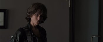 Movie still from “Destroyer” (2018), directed by Karyn Kusama – A woman standing in front of a wall with her hair blowing in the wind; Close Up shot, Over the shoulder angle