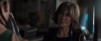 Movie still from “Destroyer” (2018), directed by Karyn Kusama – A person wearing a black jacket; Close Up shot, Over the shoulder angle