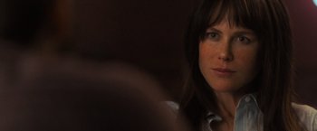 Movie still from “Destroyer” (2018), directed by Karyn Kusama – A woman's face in a dark room; Close Up shot, Over the shoulder angle