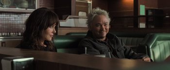 Movie still from “Destroyer” (2018), directed by Karyn Kusama – A man and a woman sitting at a table; Medium shot, Over the shoulder angle